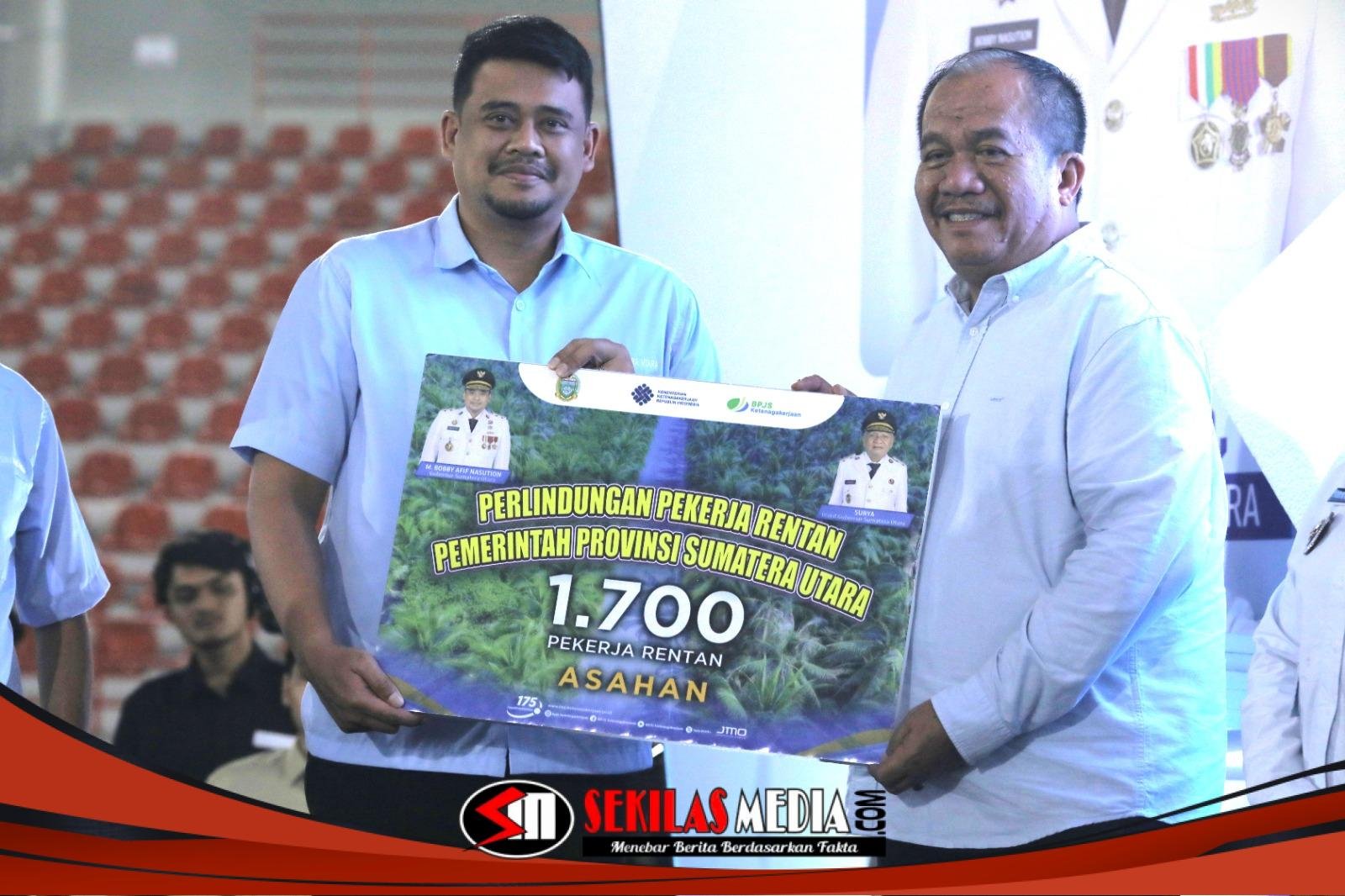 Bupati Asahan Terima 1.700 Kartu BPJS Ketenagakerjaan di May Day Sumatera Utara